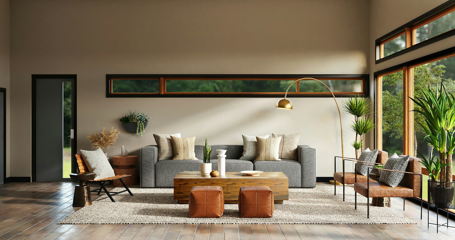 Living room with a grey sofa, leather poufs and clerestory windows